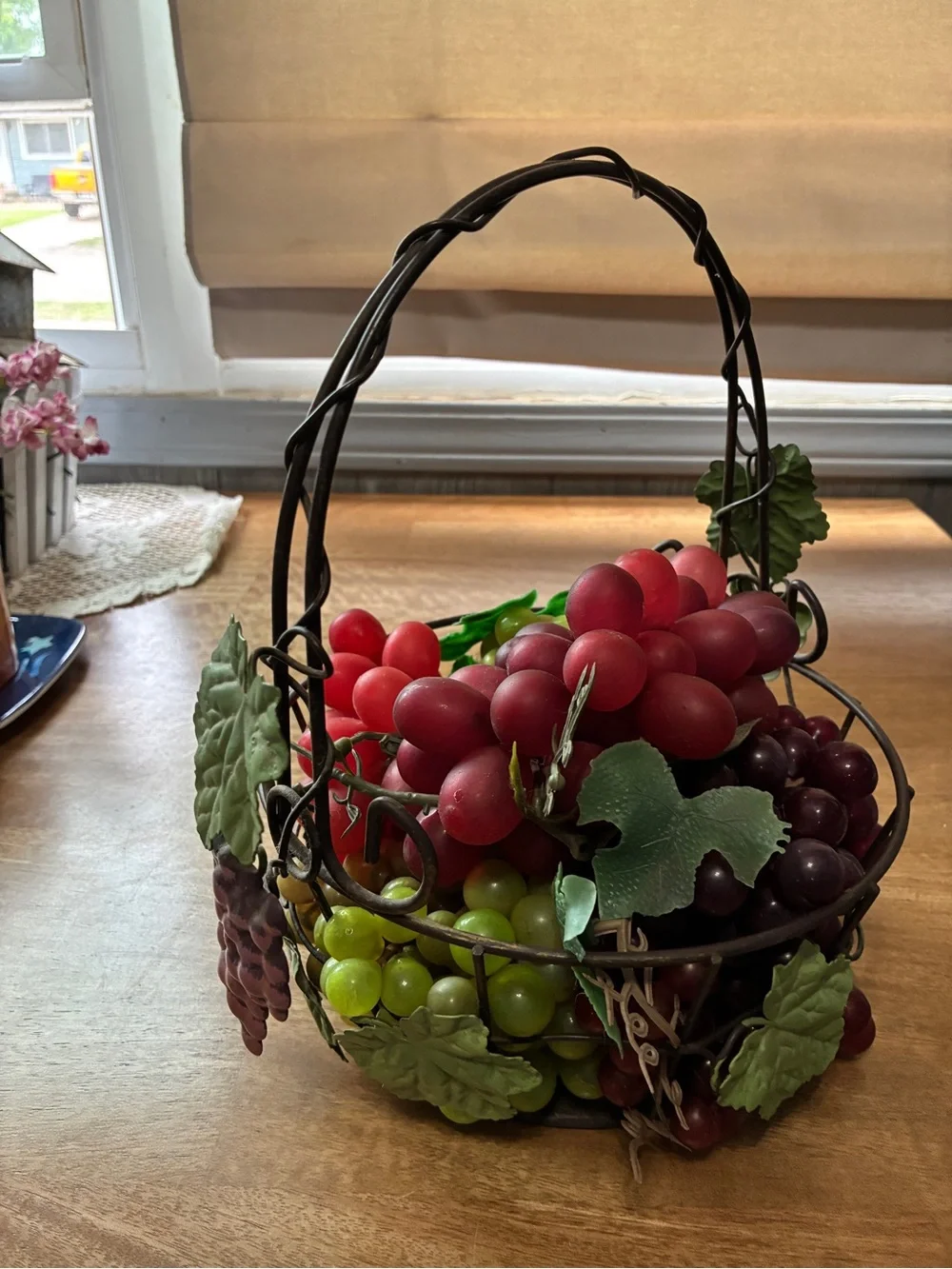 decorative artificial grape clusters, in a wire basket 8” x 10”